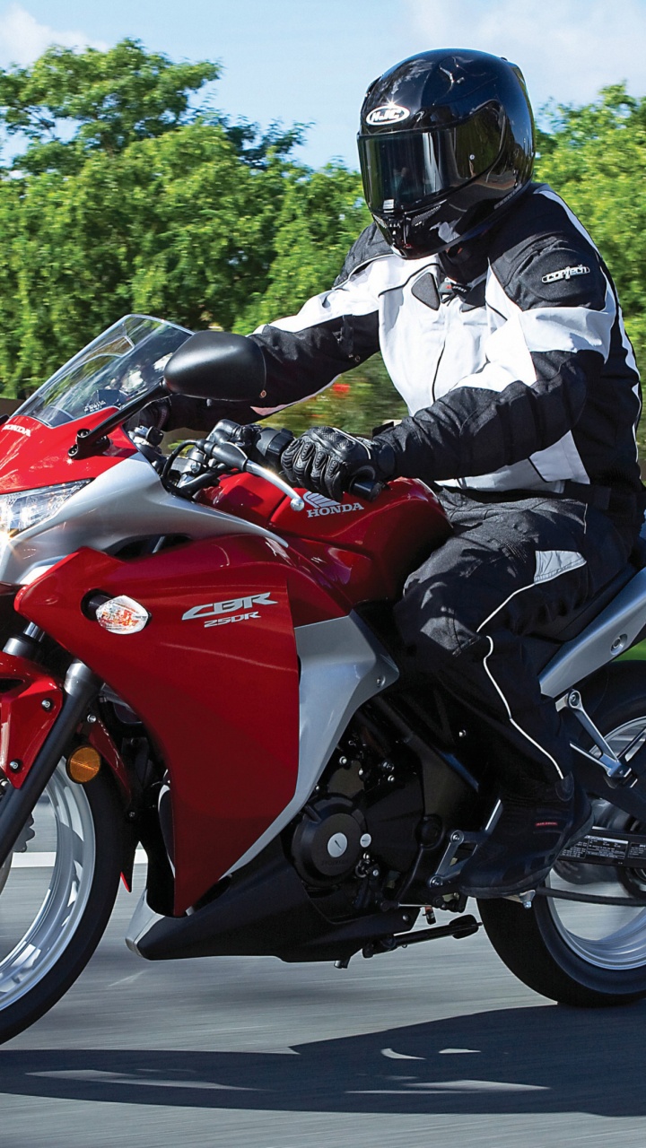 Man in White Jacket Riding Red Sports Bike on Road During Daytime. Wallpaper in 720x1280 Resolution