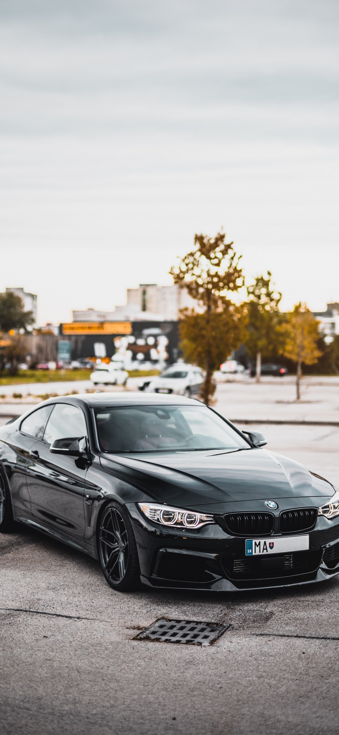 Black Mercedes Benz Coupe on Road During Daytime. Wallpaper in 1125x2436 Resolution