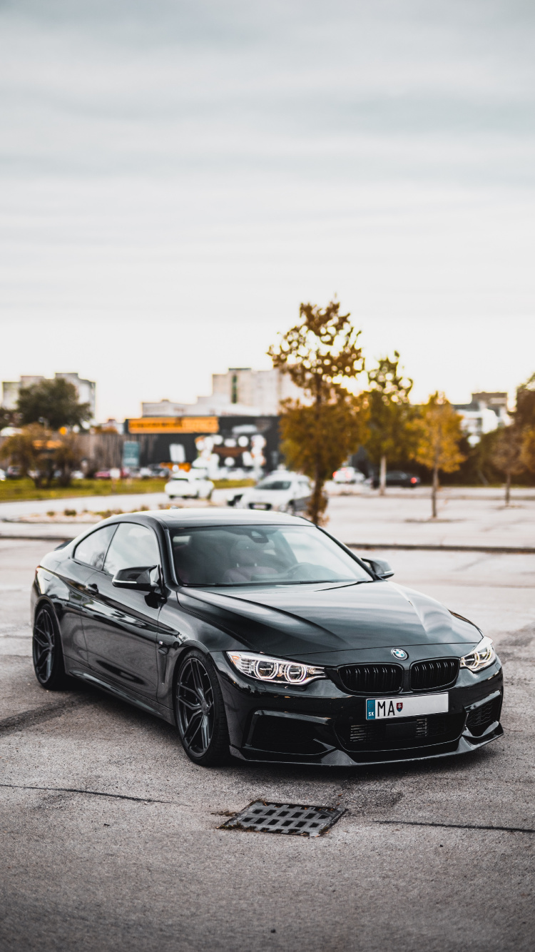 Black Mercedes Benz Coupe on Road During Daytime. Wallpaper in 750x1334 Resolution