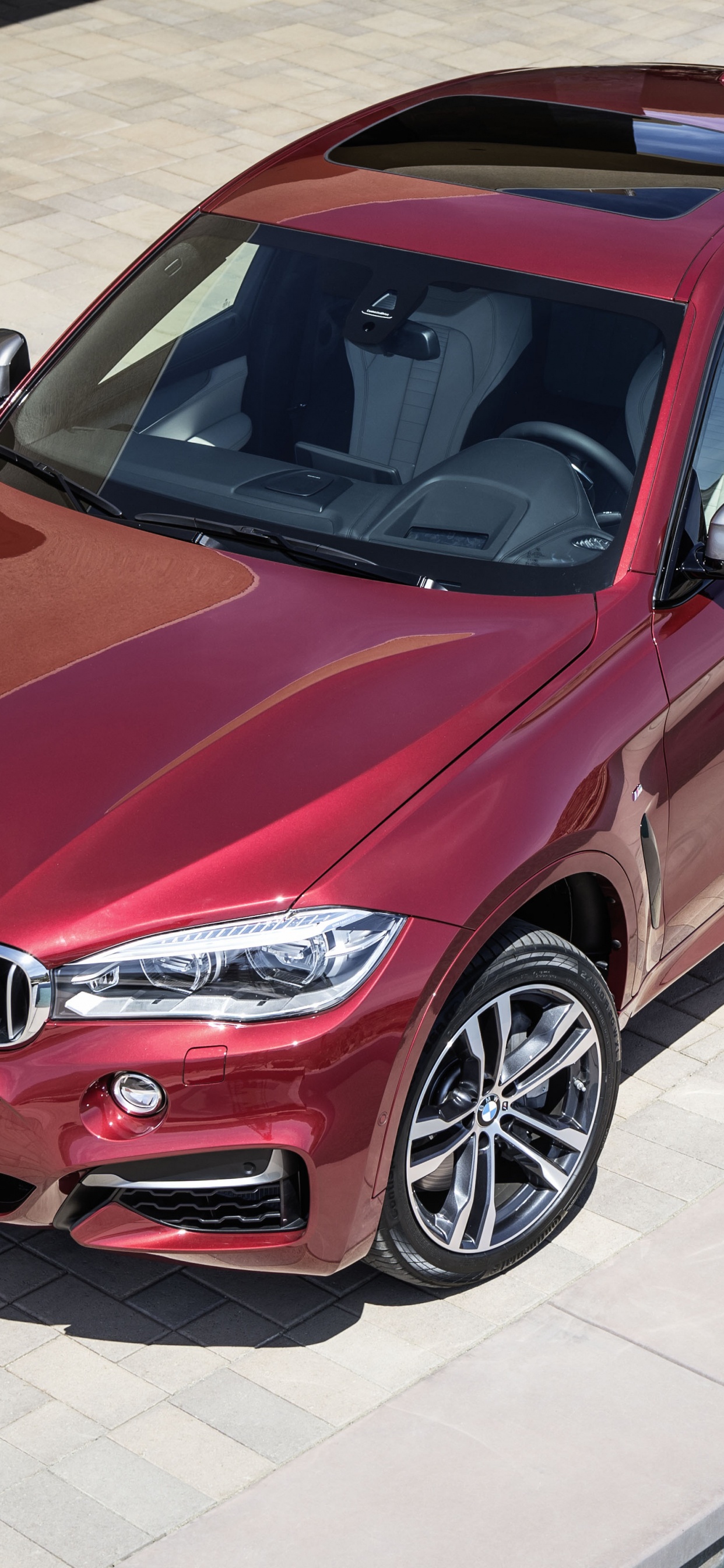 Red Bmw m 3 Coupe Parked on Gray Concrete Pavement During Daytime. Wallpaper in 1242x2688 Resolution