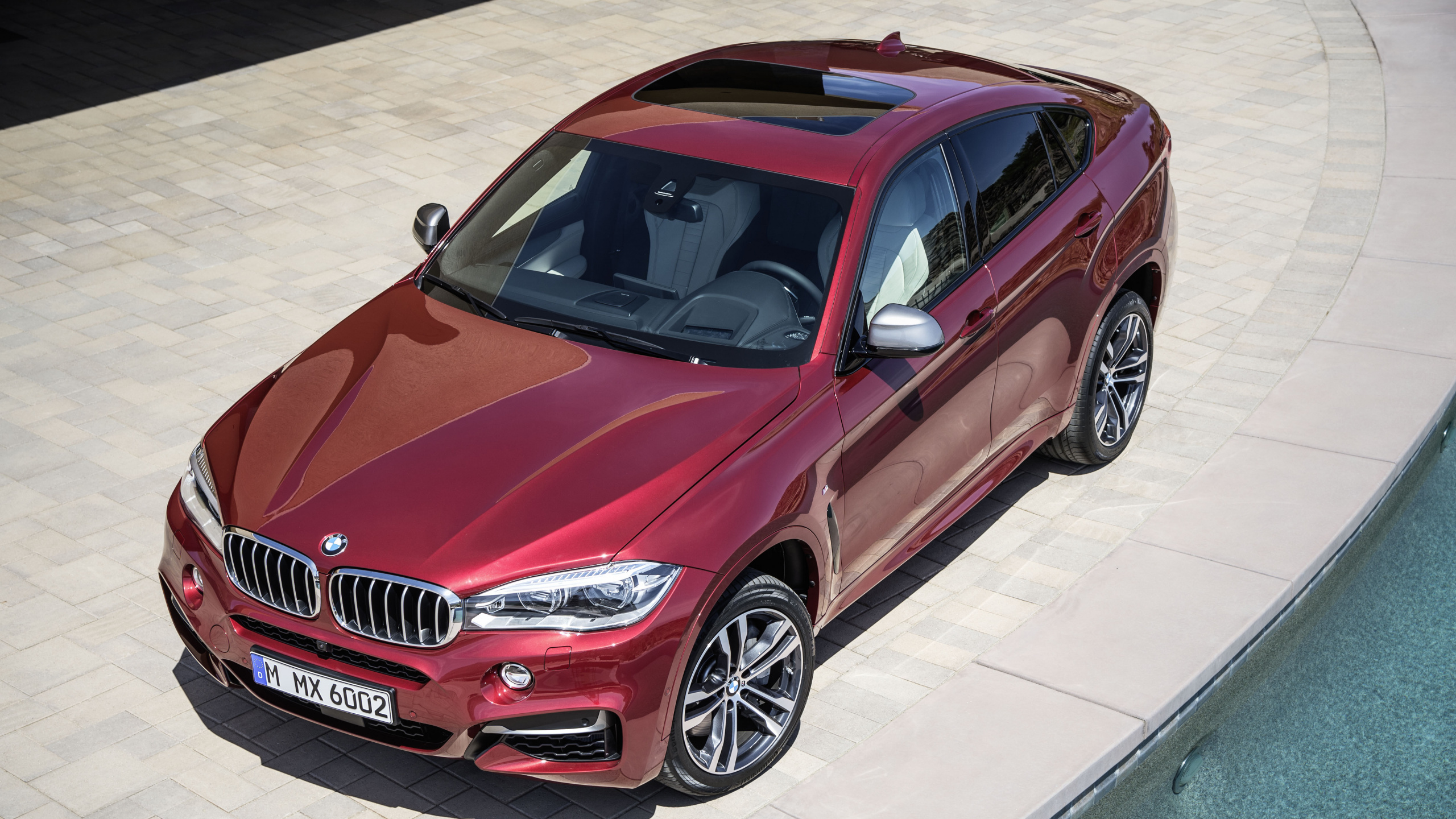 Red Bmw m 3 Coupe Parked on Gray Concrete Pavement During Daytime. Wallpaper in 2560x1440 Resolution