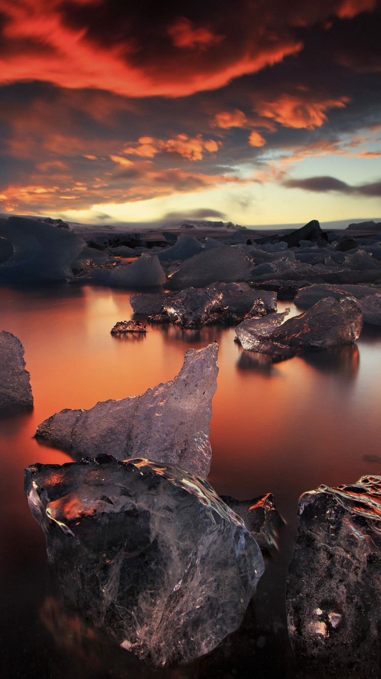 Brown Rock Formation Near Body of Water During Daytime. Wallpaper in 750x1334 Resolution