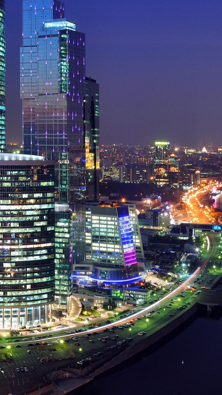 City Skyline During Night Time. Wallpaper in 720x1280 Resolution