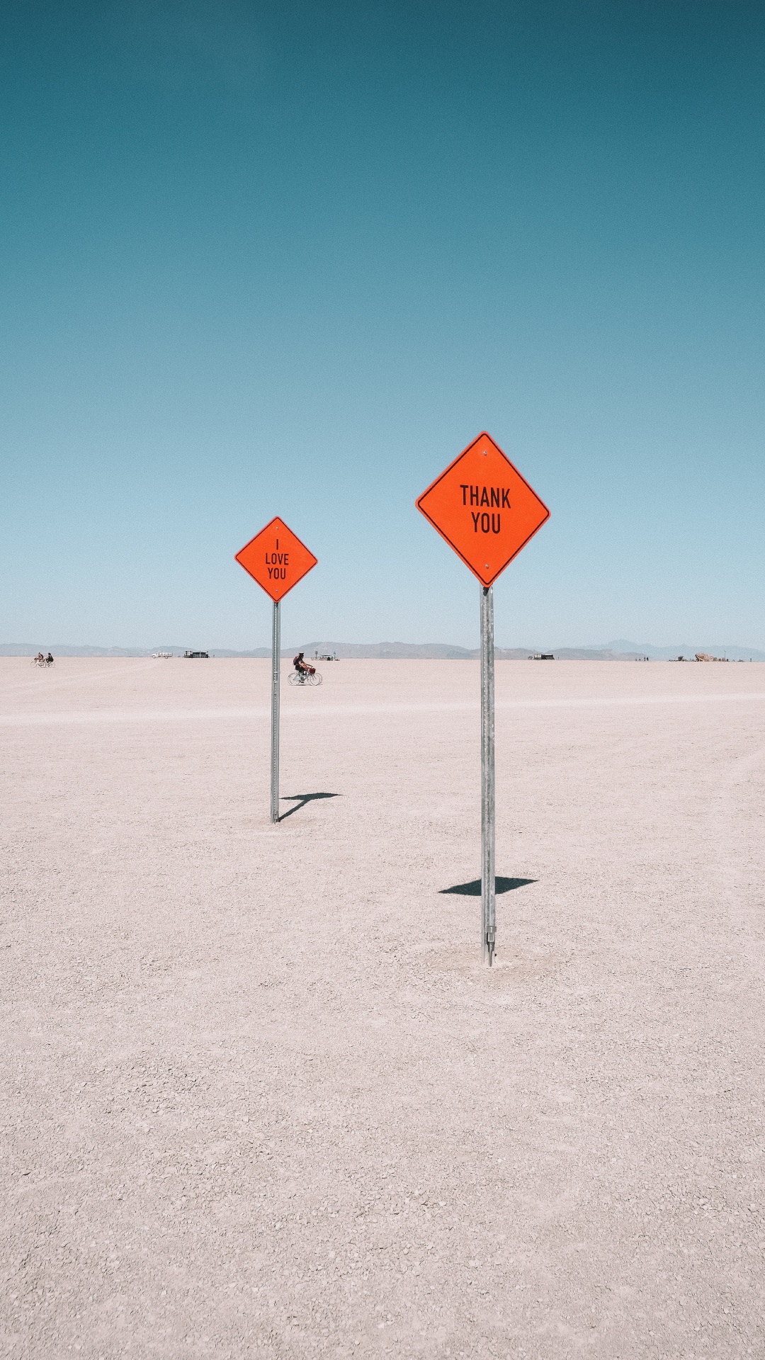 Red and White Stop Sign on White Sand During Daytime. Wallpaper in 1080x1920 Resolution