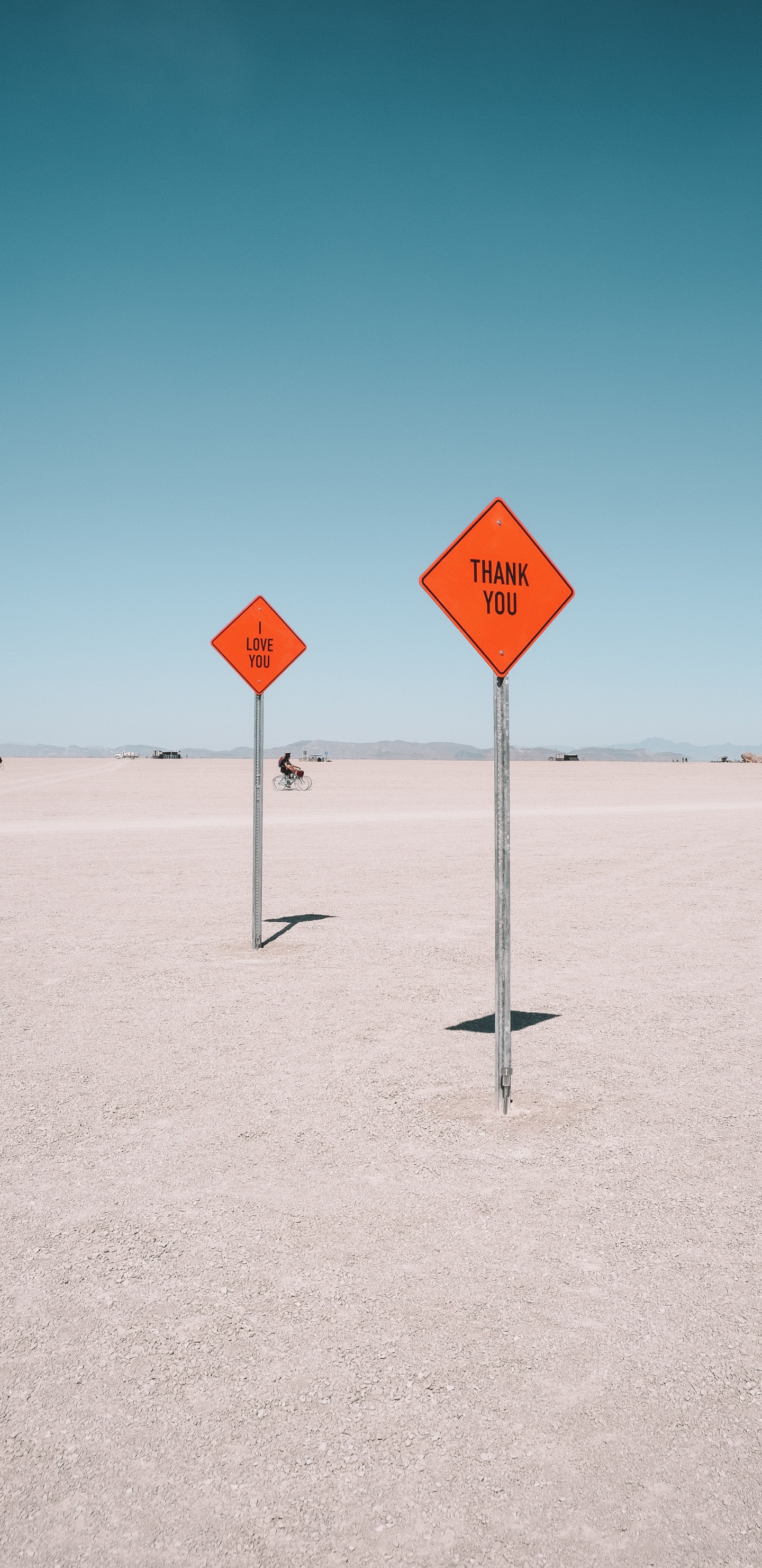 Red and White Stop Sign on White Sand During Daytime. Wallpaper in 1440x2960 Resolution