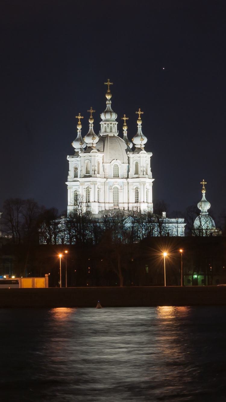 White Concrete Building During Night Time. Wallpaper in 750x1334 Resolution
