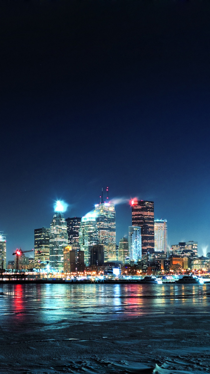 City Skyline During Night Time. Wallpaper in 720x1280 Resolution