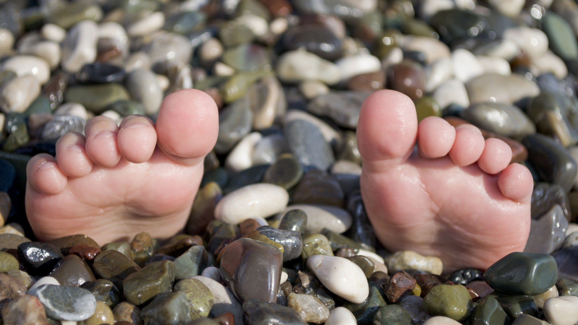 Person Holding Gray and White Pebbles. Wallpaper in 1920x1080 Resolution
