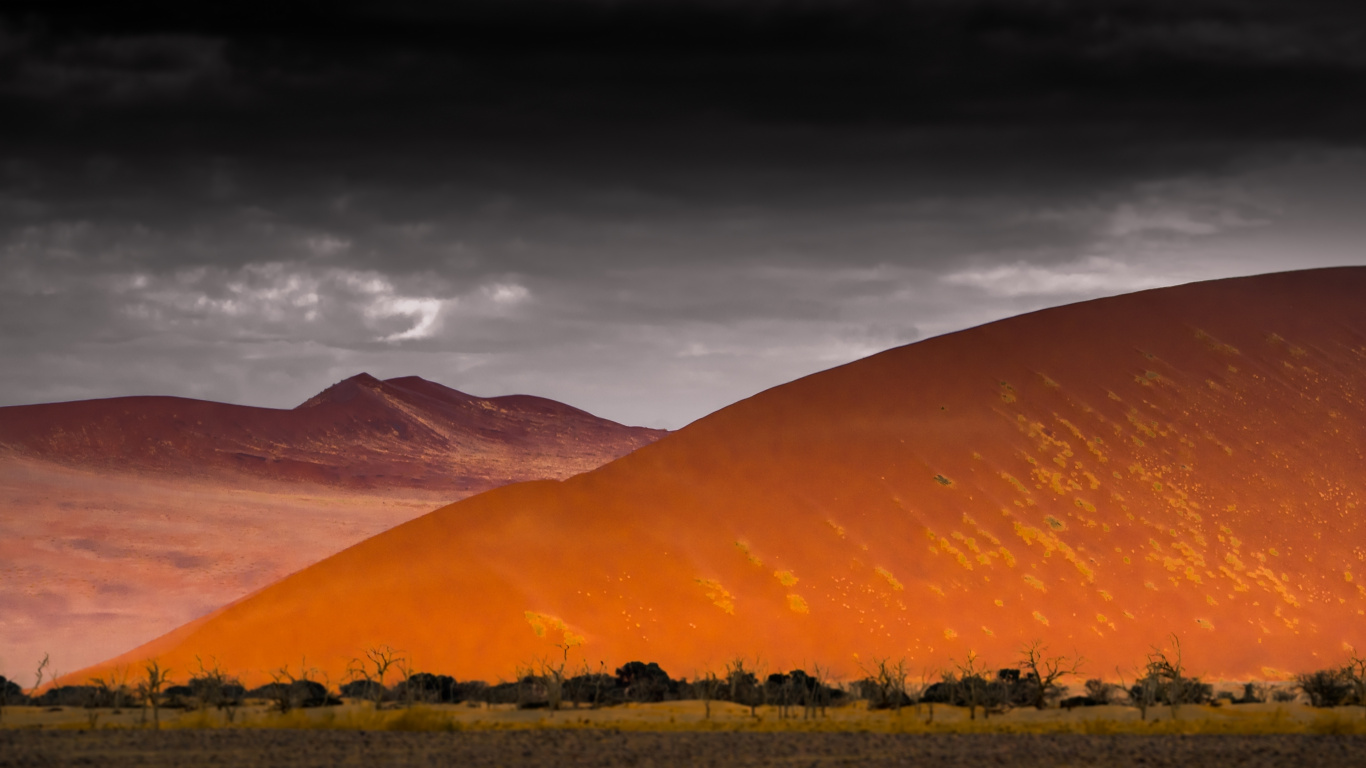 Brown Mountain Under Gray Sky During Sunset. Wallpaper in 1366x768 Resolution