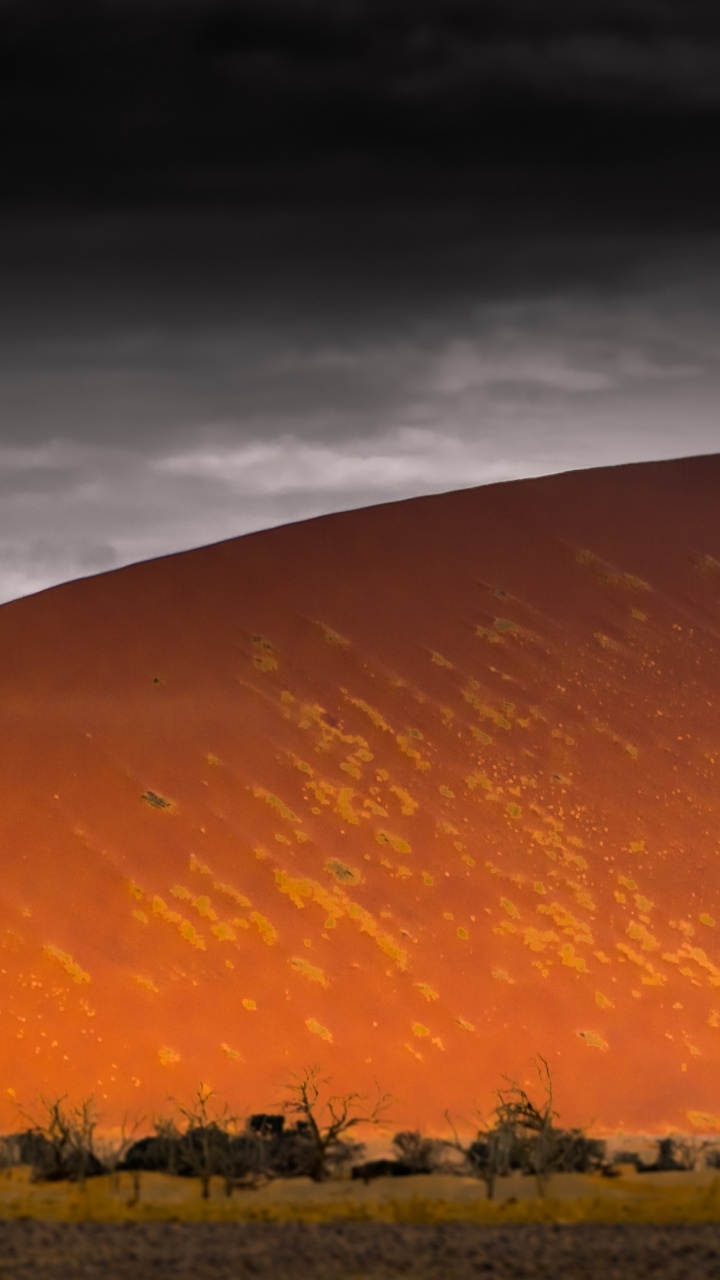 Brown Mountain Under Gray Sky During Sunset. Wallpaper in 720x1280 Resolution