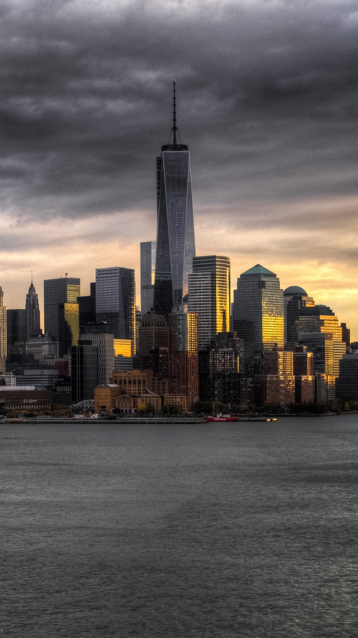 City Skyline Across Body of Water During Daytime. Wallpaper in 720x1280 Resolution