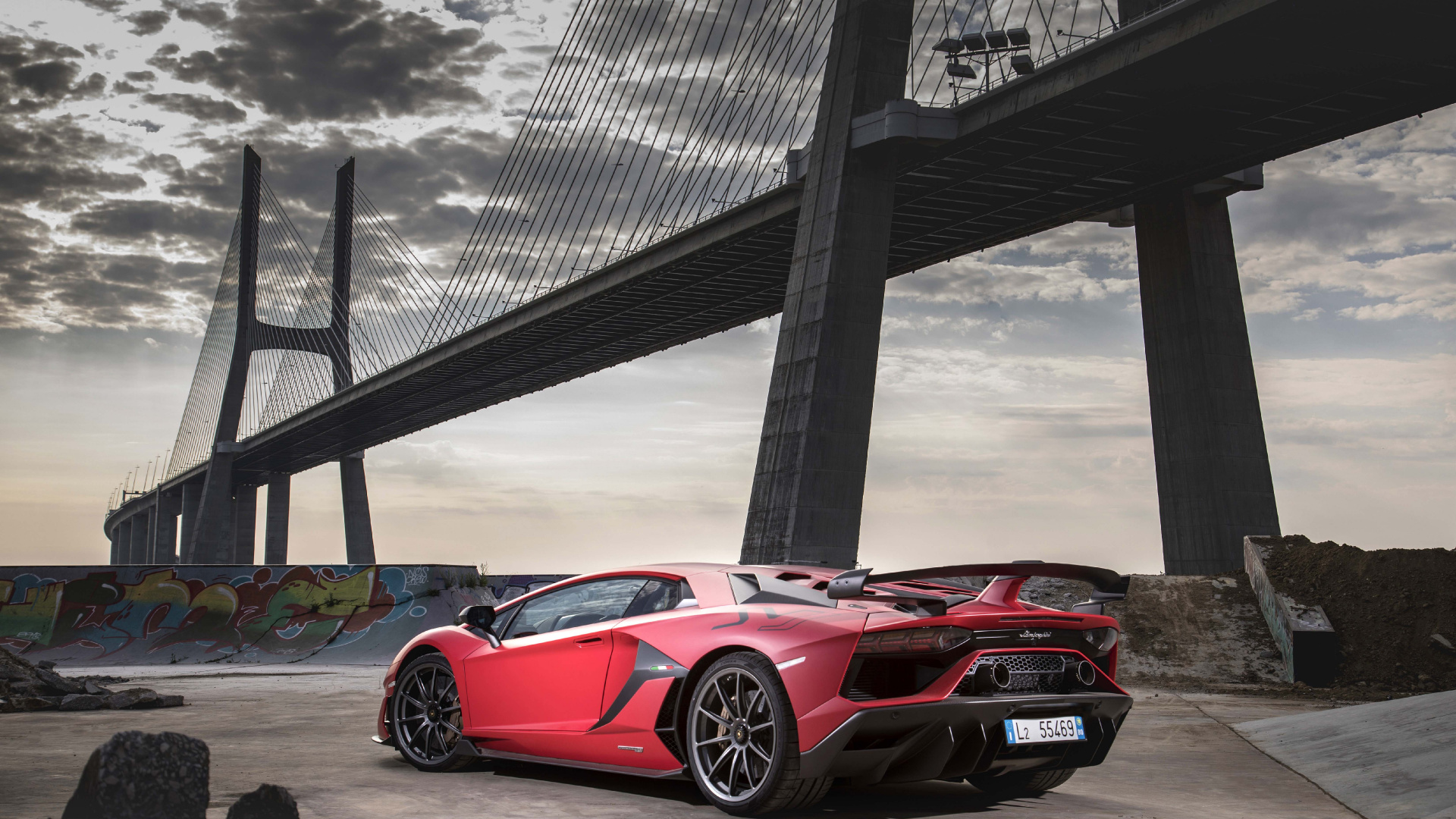 Red Ferrari 458 Italia Parked Near Bridge. Wallpaper in 1920x1080 Resolution