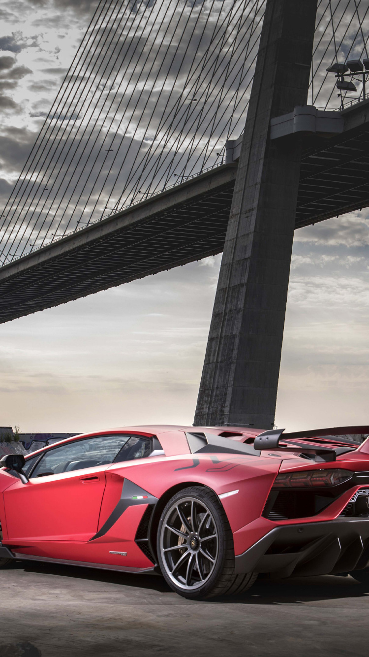 Roter Ferrari 458 Italia in Der Nähe Der Brücke Geparkt. Wallpaper in 750x1334 Resolution