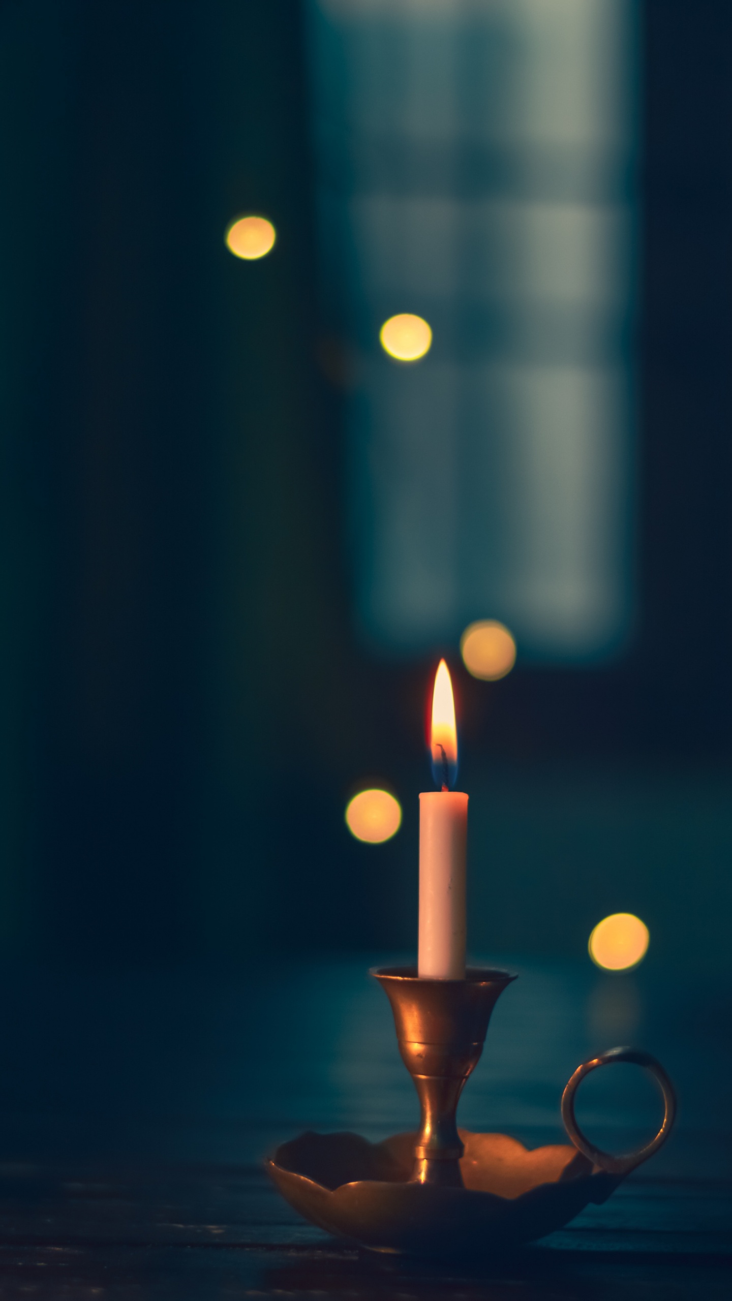 Lighted Candle in Black Holder. Wallpaper in 1440x2560 Resolution