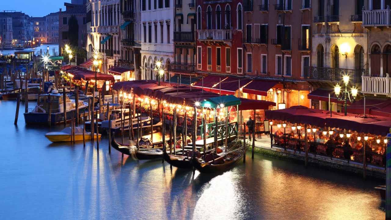 People Riding on Boat on River Near Buildings During Night Time. Wallpaper in 1280x720 Resolution