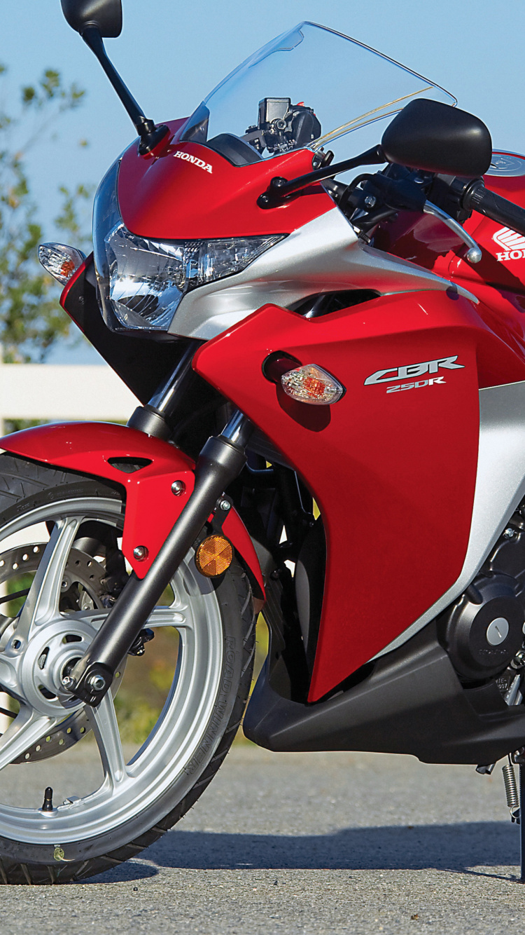 Red and Black Sports Bike on Road During Daytime. Wallpaper in 750x1334 Resolution