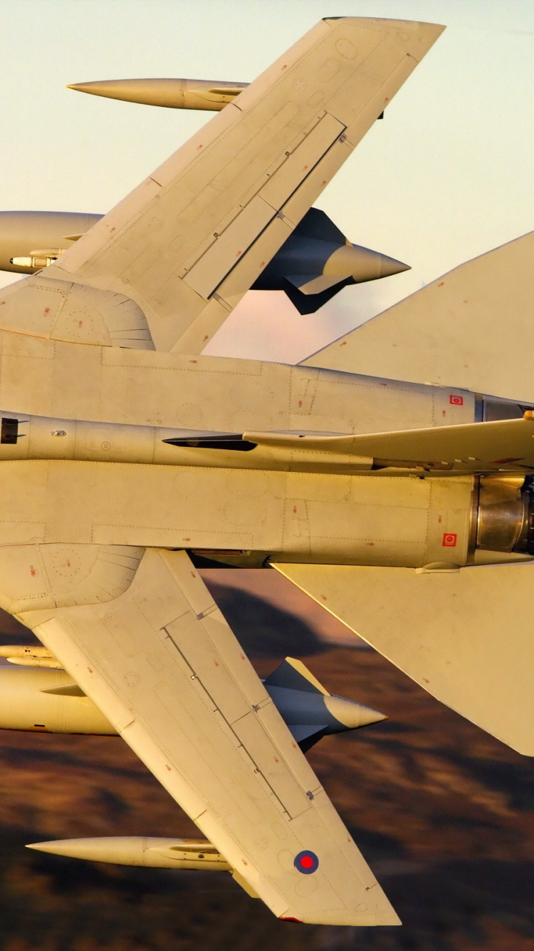Gray Fighter Jet Flying Over Brown Field During Daytime. Wallpaper in 750x1334 Resolution