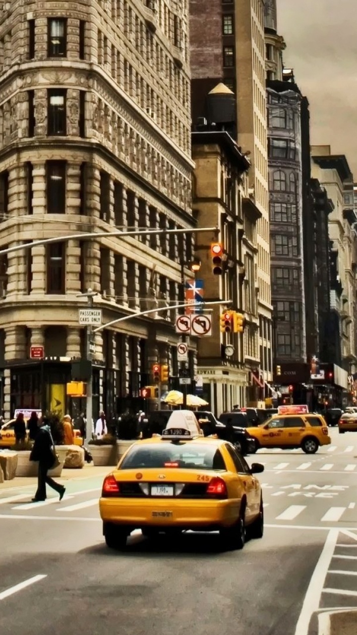 People Walking on Pedestrian Lane in Front of Brown Concrete Building During Daytime. Wallpaper in 720x1280 Resolution