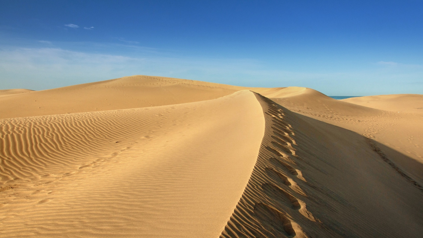Brown Sand Under Blue Sky During Daytime. Wallpaper in 1366x768 Resolution