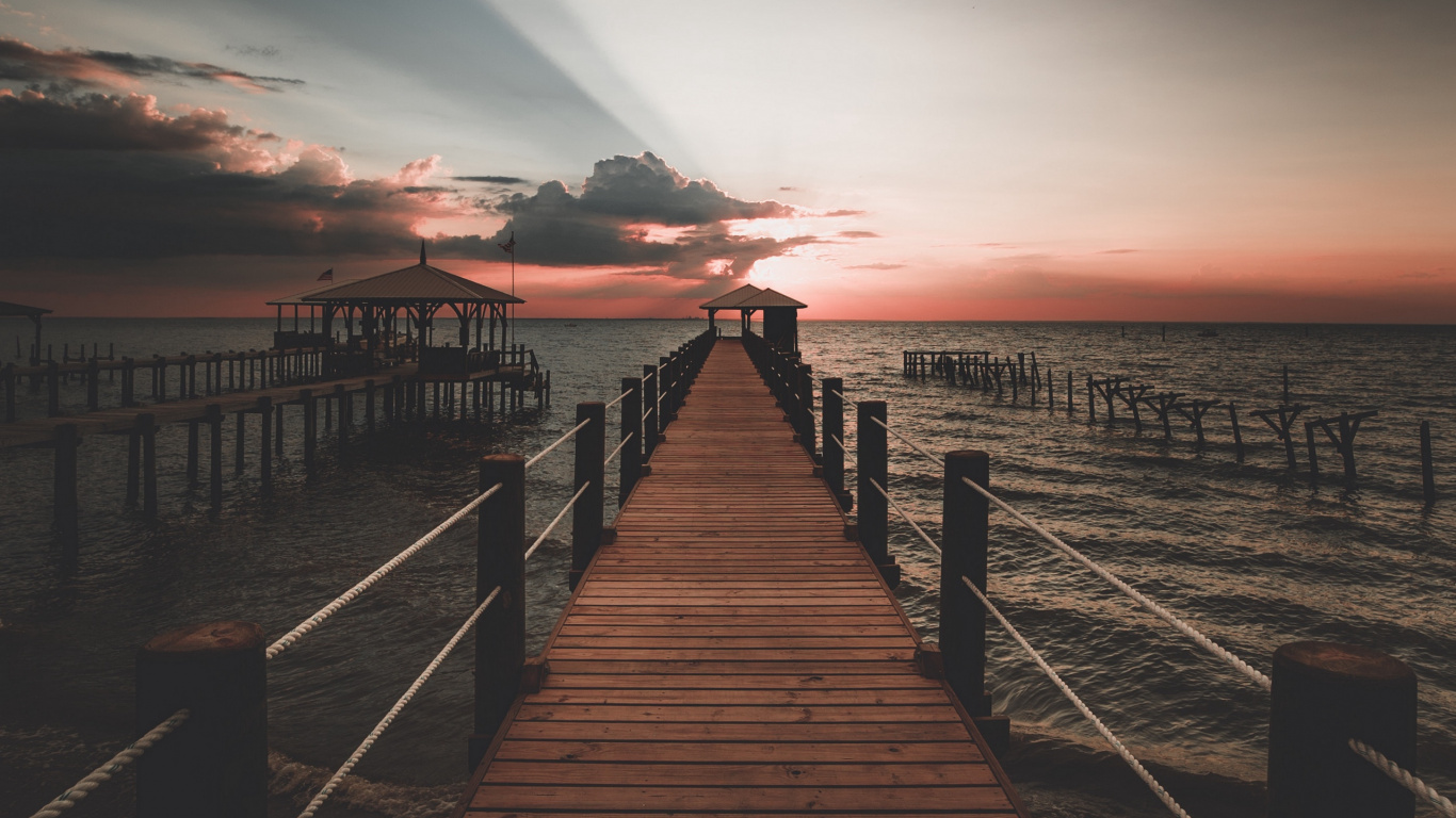 Brown Wooden Dock on Sea During Sunset. Wallpaper in 1366x768 Resolution
