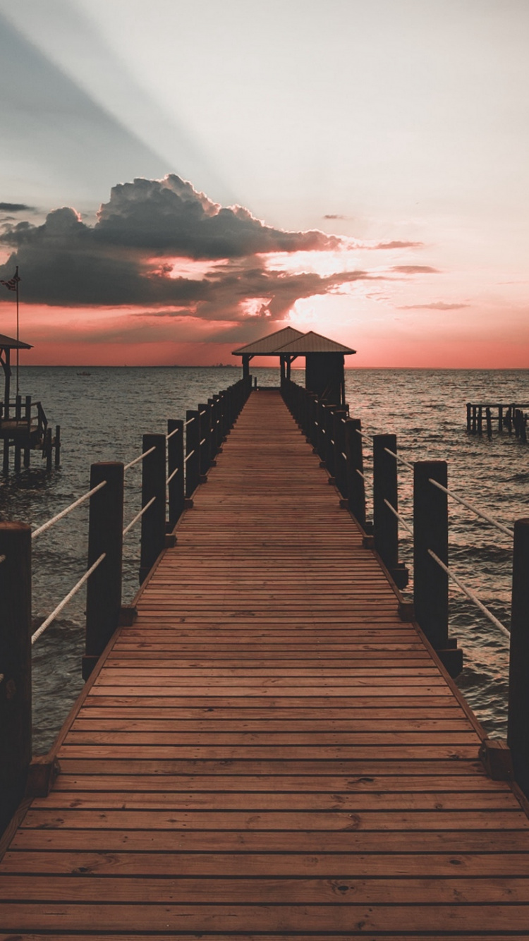 Brown Wooden Dock on Sea During Sunset. Wallpaper in 750x1334 Resolution