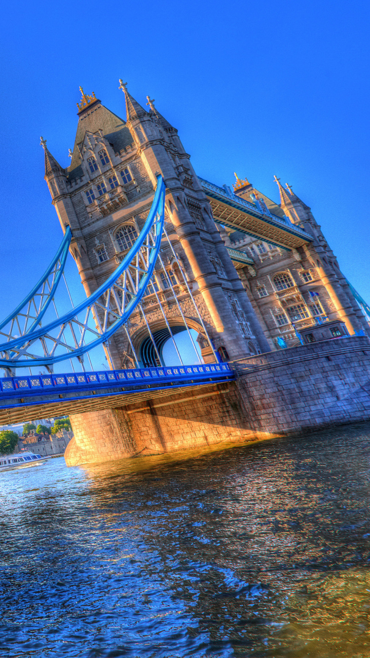 Bridge Over River Under Blue Sky During Daytime. Wallpaper in 750x1334 Resolution