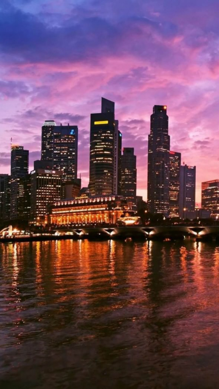 City Skyline Near Body of Water During Night Time. Wallpaper in 750x1334 Resolution