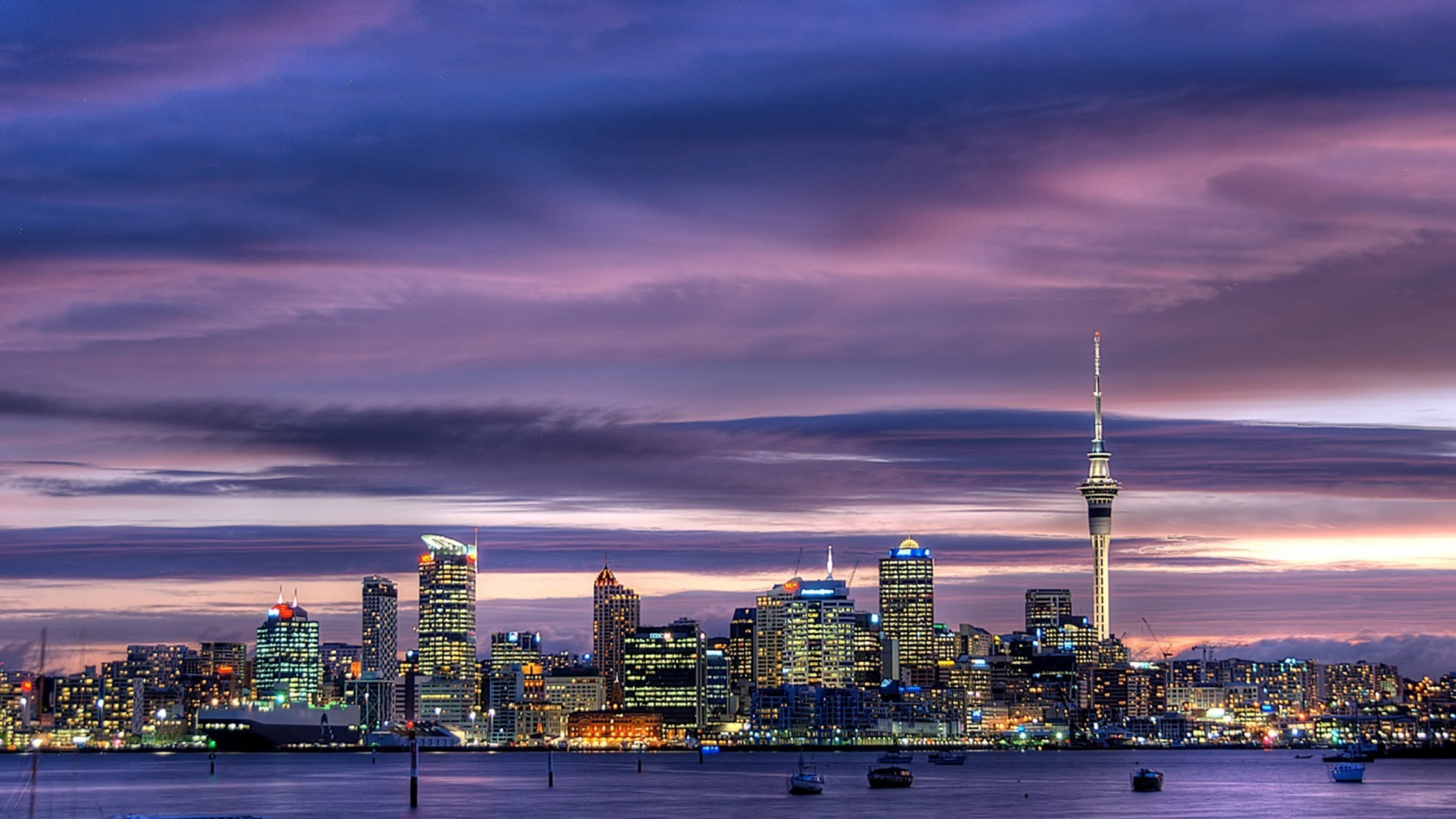 City Skyline Under Cloudy Sky During Night Time. Wallpaper in 1920x1080 Resolution