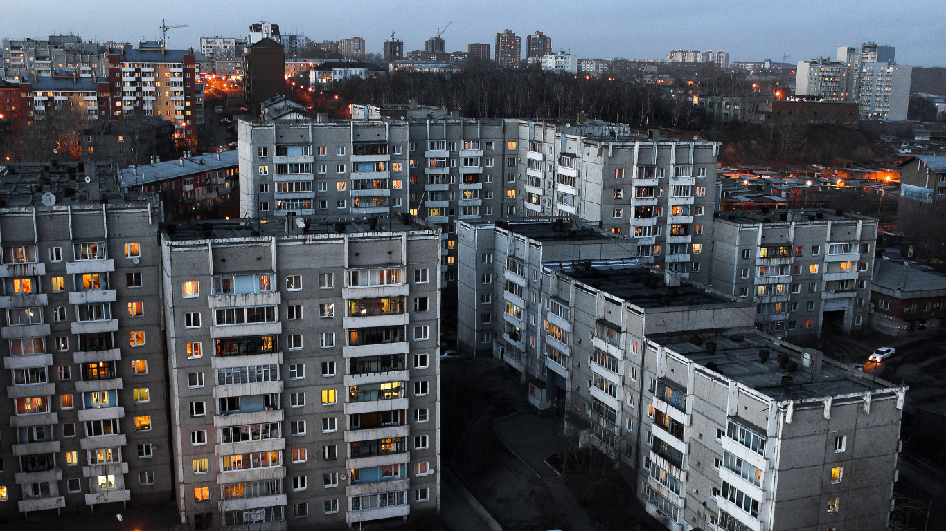 Cars on Road Near High Rise Buildings During Night Time. Wallpaper in 1366x768 Resolution