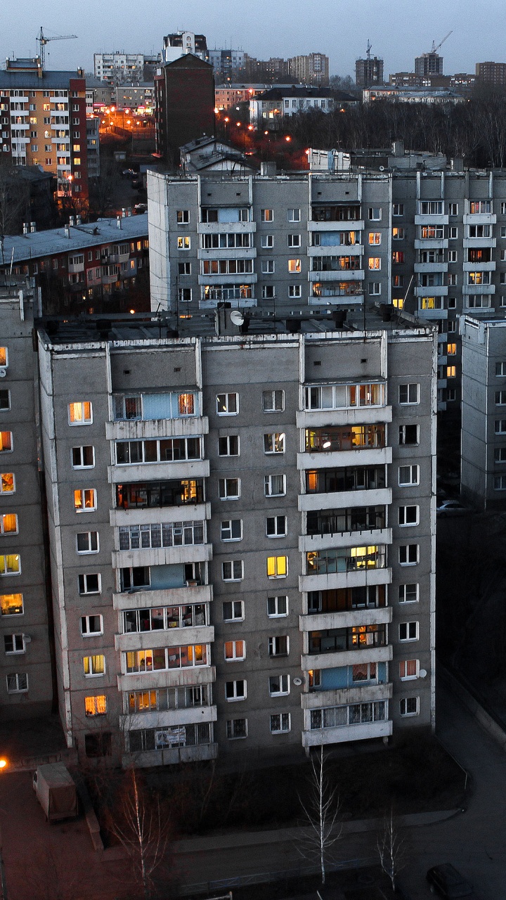 Cars on Road Near High Rise Buildings During Night Time. Wallpaper in 720x1280 Resolution