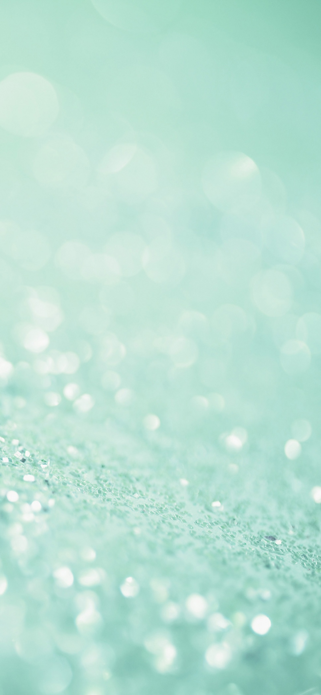 Water Droplets on Green Surface. Wallpaper in 1125x2436 Resolution