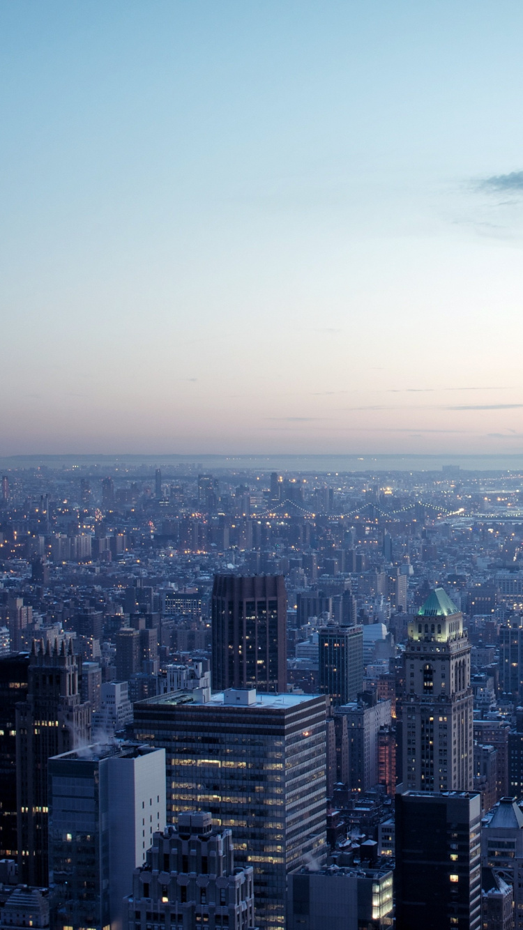 High Rise Buildings Under White Clouds During Daytime. Wallpaper in 750x1334 Resolution