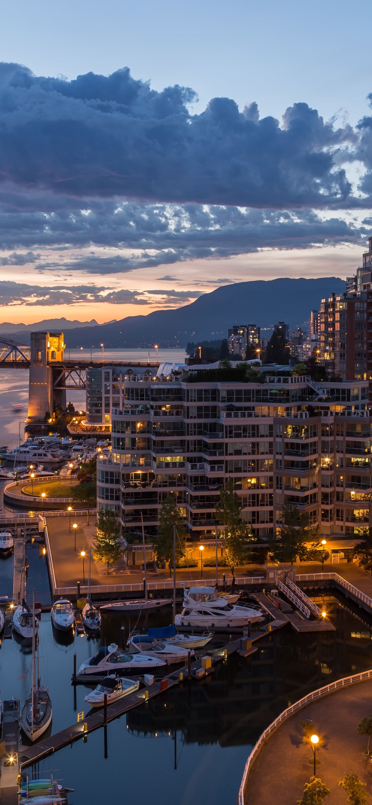 Luftaufnahme Von Stadtgebäuden Während Der Nacht. Wallpaper in 1242x2688 Resolution