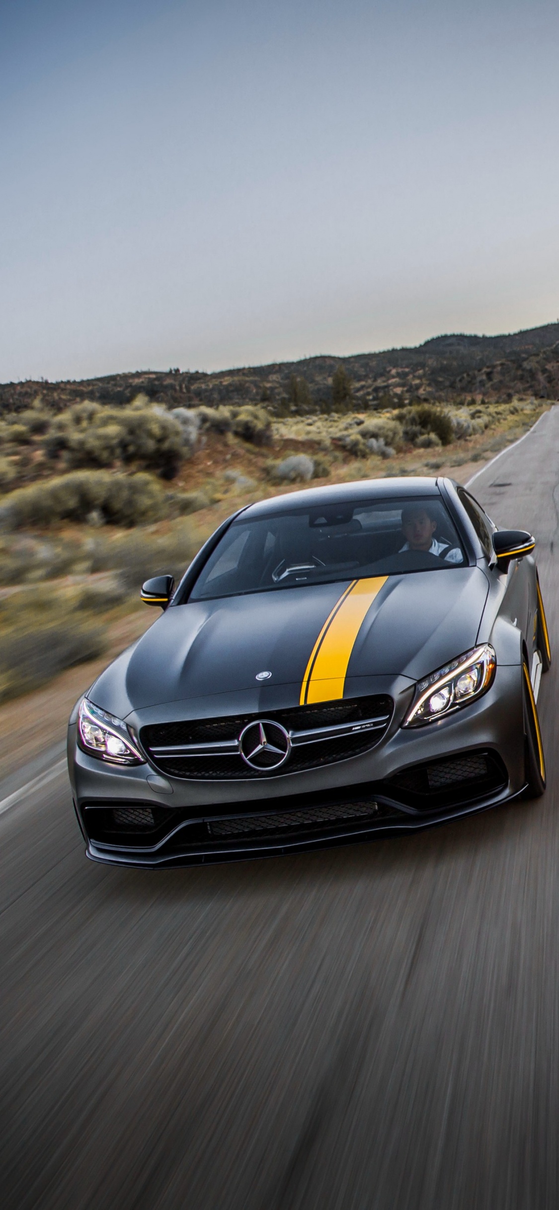 Gelber Bmw m 3 Tagsüber Unterwegs. Wallpaper in 1125x2436 Resolution