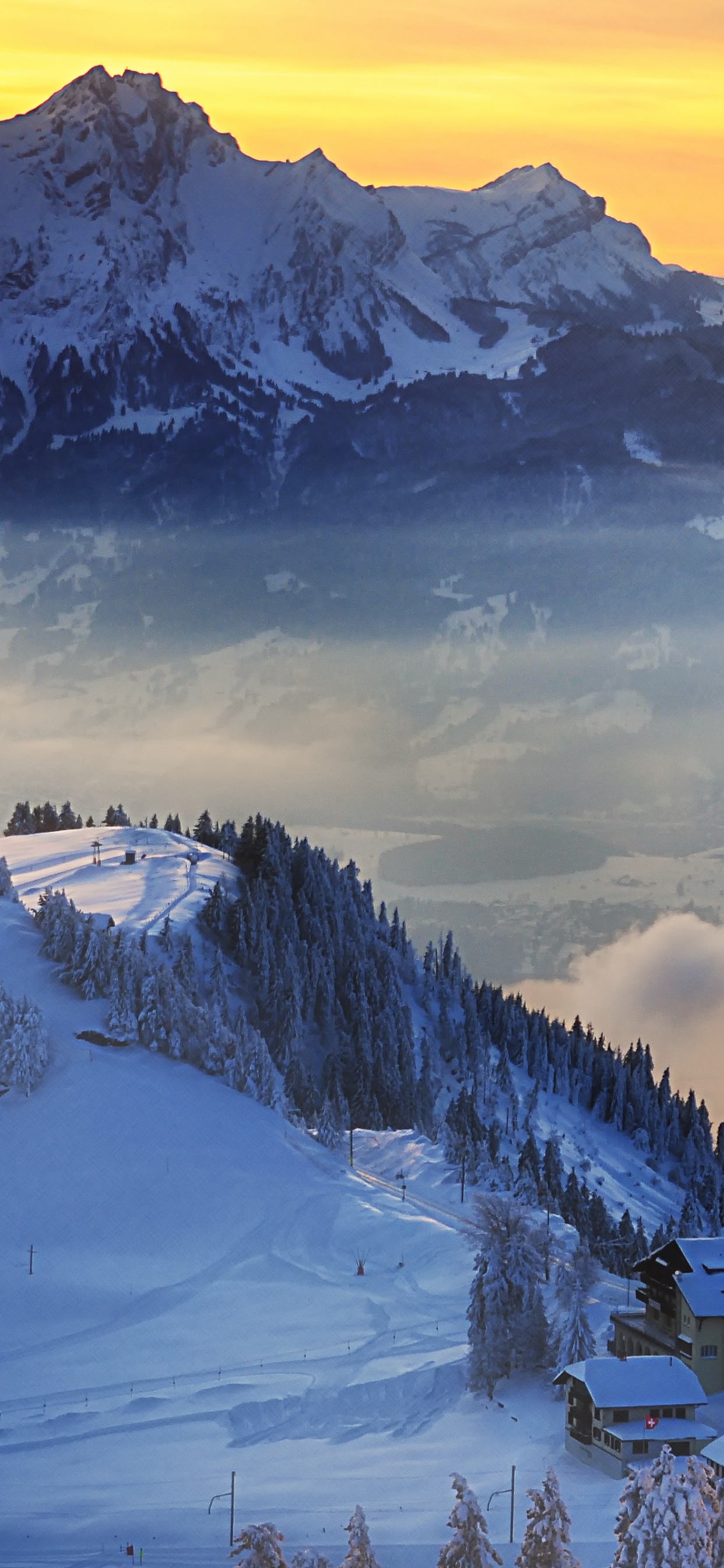 Snow Covered Mountain Under Cloudy Sky During Daytime. Wallpaper in 1242x2688 Resolution