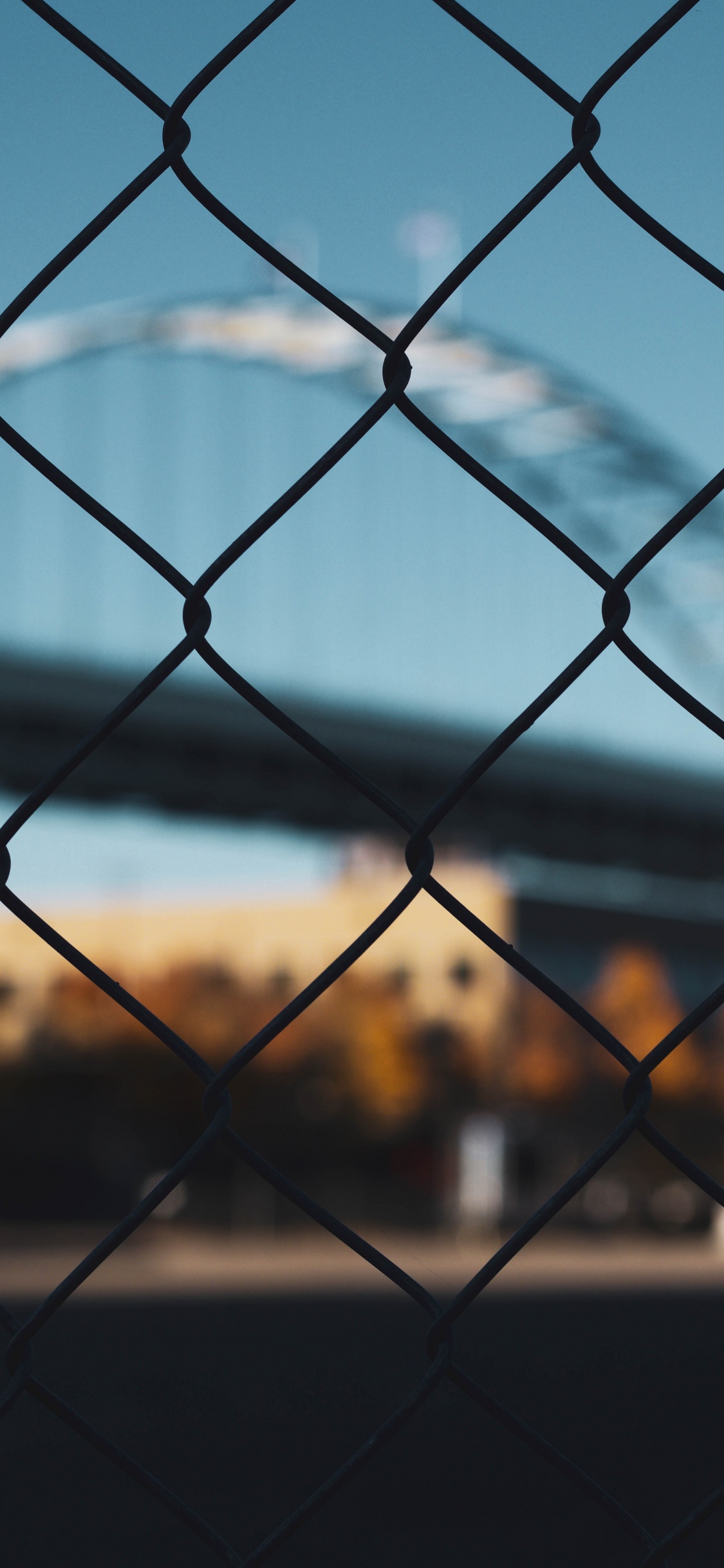 Grey Metal Fence With Water Droplets. Wallpaper in 1125x2436 Resolution