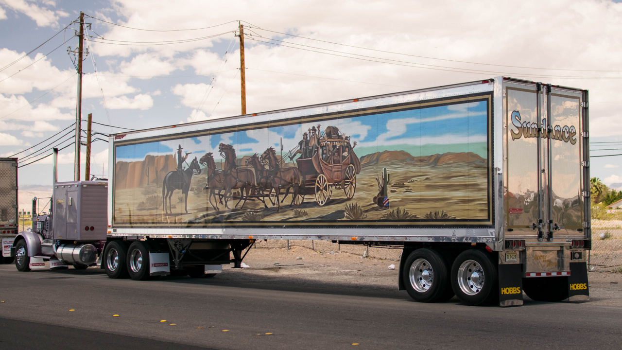 Black and Brown Trailer Truck on Road During Daytime. Wallpaper in 1280x720 Resolution