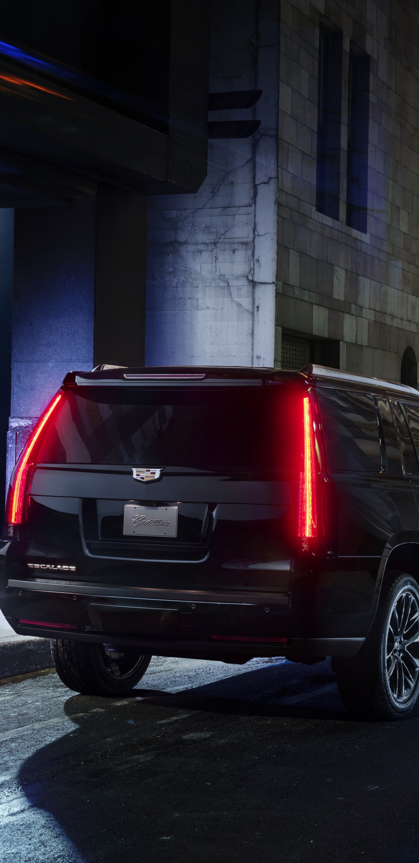 Black Suv Parked Beside Red Van. Wallpaper in 1440x2960 Resolution