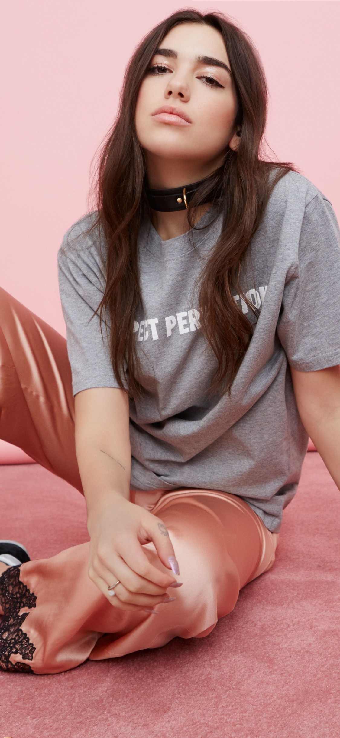 Dua Lipa, Pink, Skin, Leg, Sitting. Wallpaper in 1125x2436 Resolution