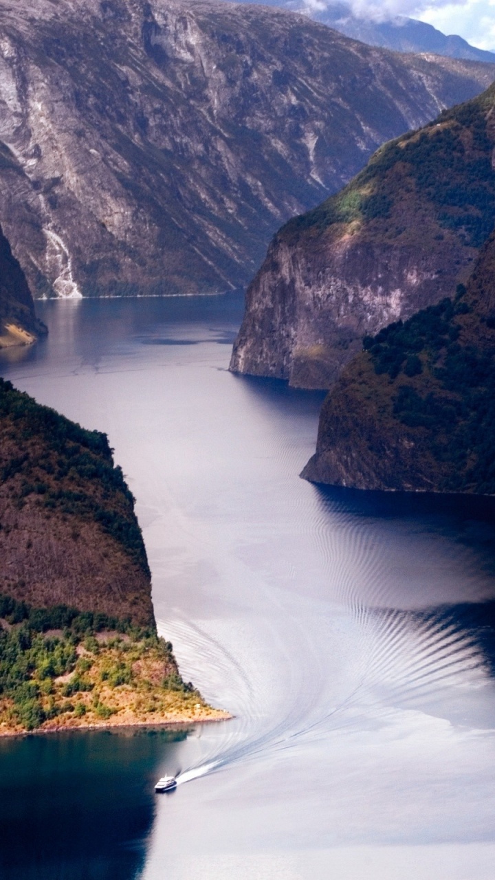 Body of Water Between Mountains During Daytime. Wallpaper in 720x1280 Resolution