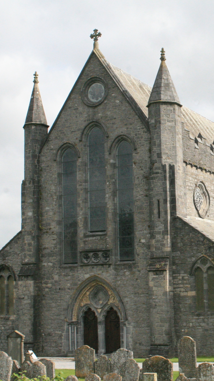 Gray Concrete Building Under White Clouds During Daytime. Wallpaper in 750x1334 Resolution