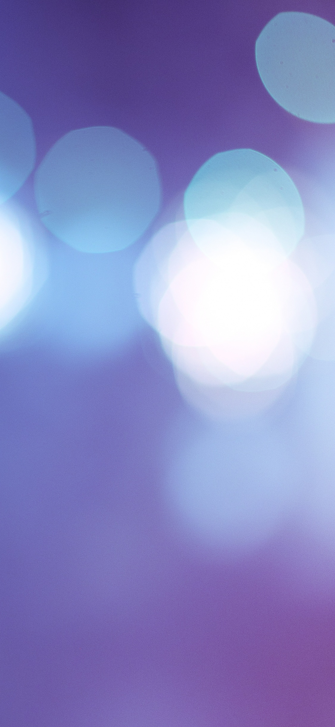 Purple and White Bokeh Lights. Wallpaper in 1125x2436 Resolution