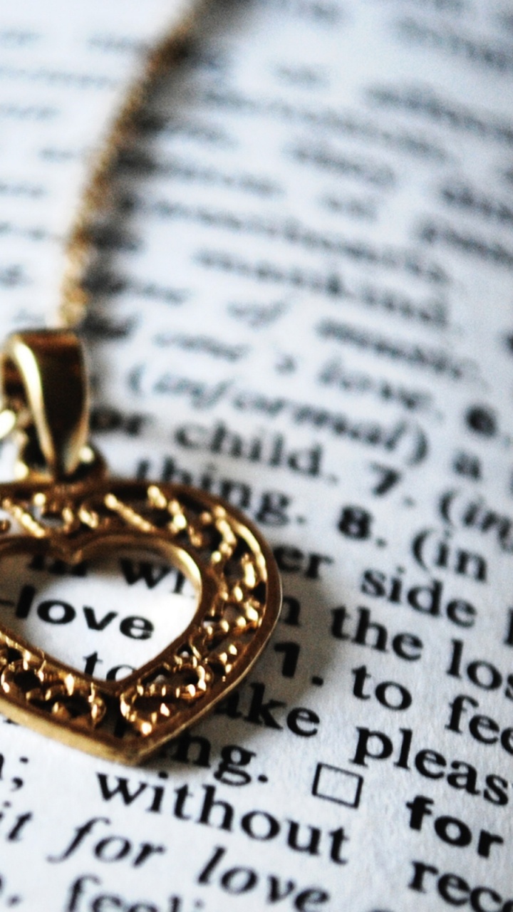 Gold Heart Pendant Necklace on White Paper. Wallpaper in 720x1280 Resolution