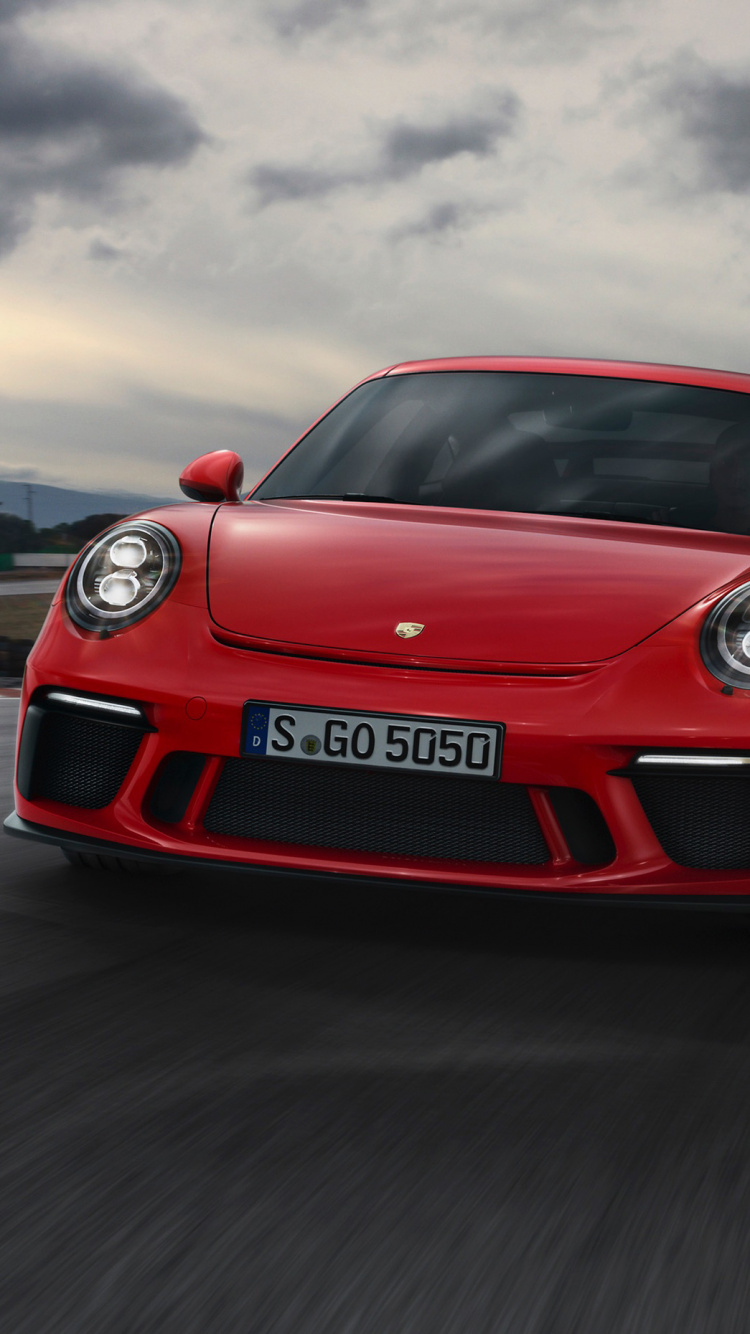Roter Porsche 911 Unterwegs Bei Bewölktem Himmel. Wallpaper in 750x1334 Resolution
