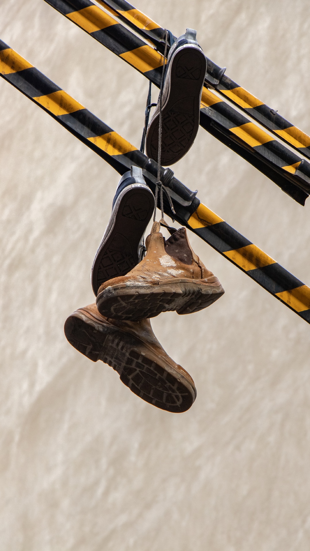 Brown and Black High Top Sneakers. Wallpaper in 1080x1920 Resolution