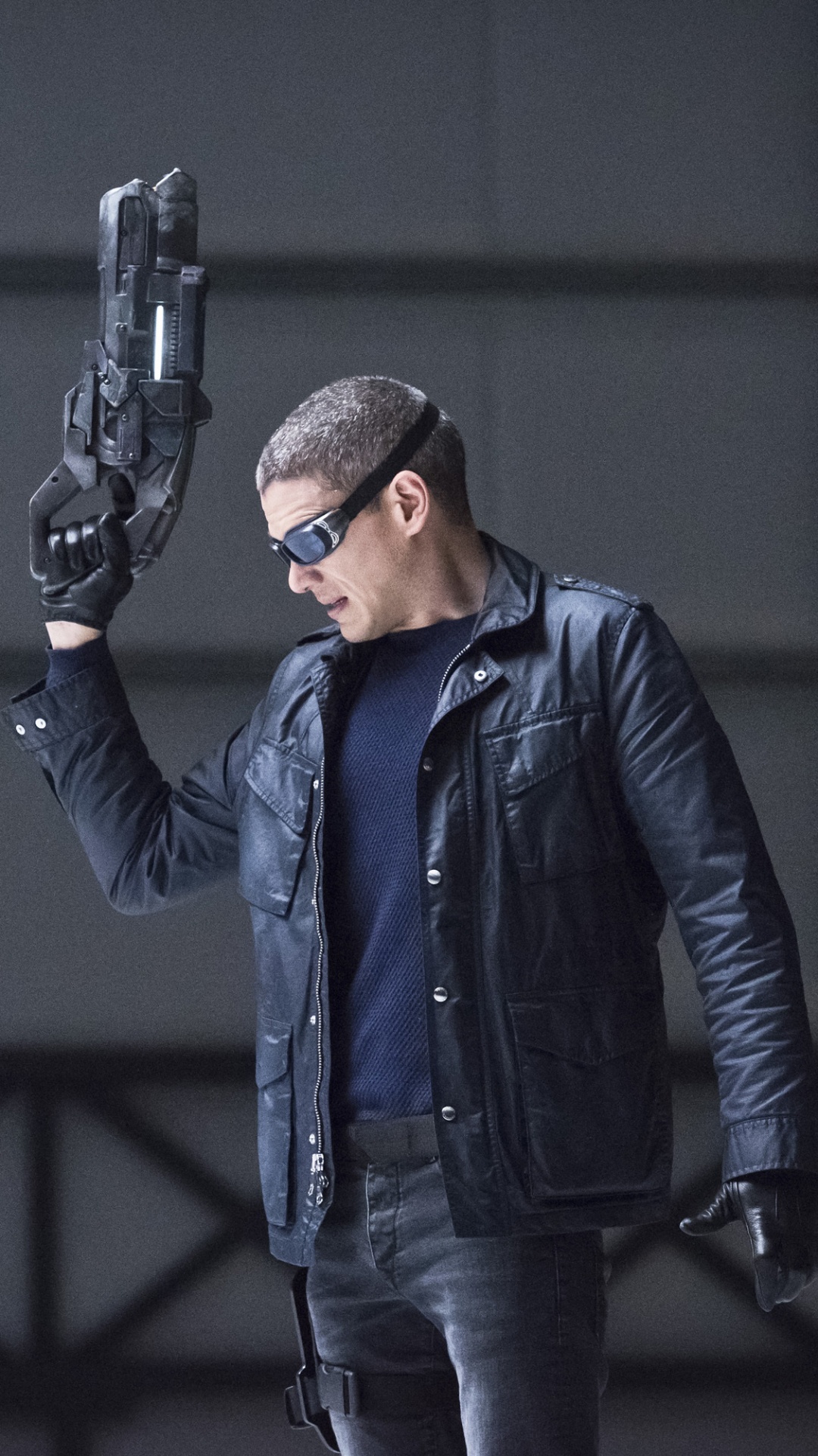 Man in Blue Jacket Holding Black Rifle. Wallpaper in 1080x1920 Resolution