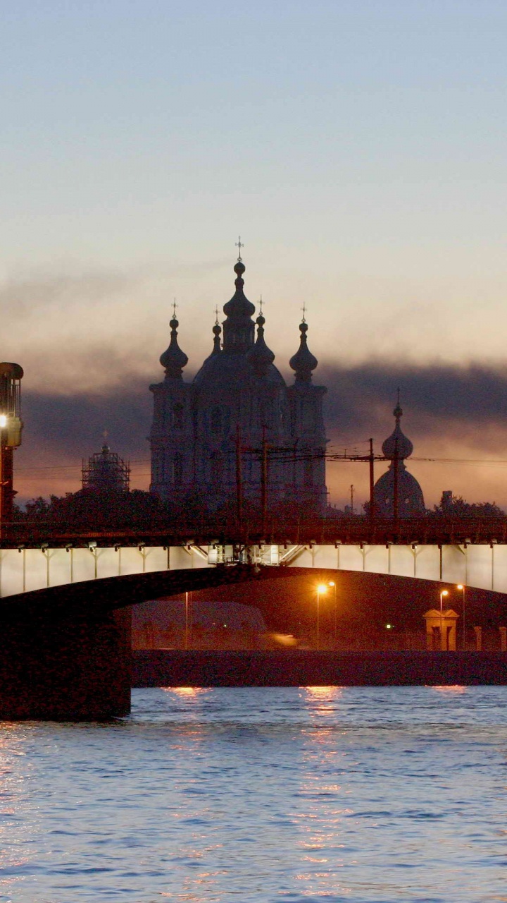 Brown Concrete Bridge Over River During Sunset. Wallpaper in 720x1280 Resolution