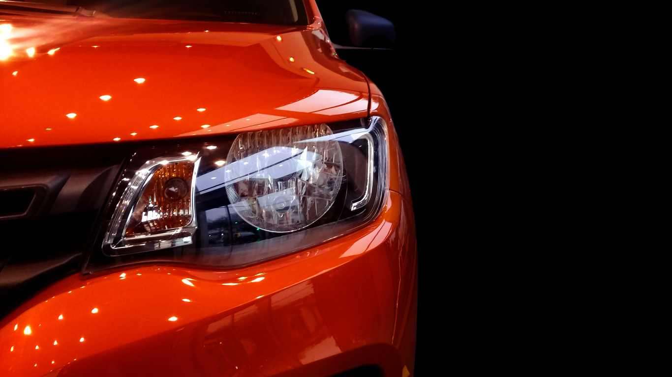 Orange Car With White Lights. Wallpaper in 1366x768 Resolution