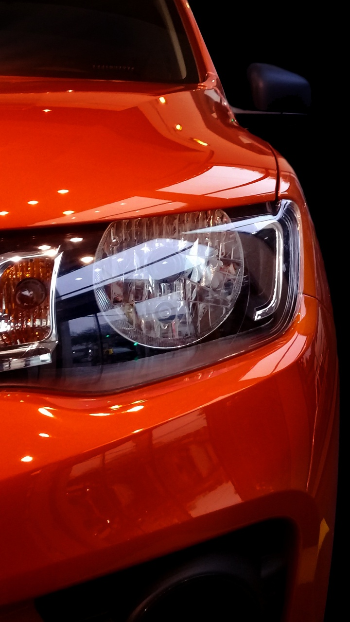 Orange Car With White Lights. Wallpaper in 720x1280 Resolution