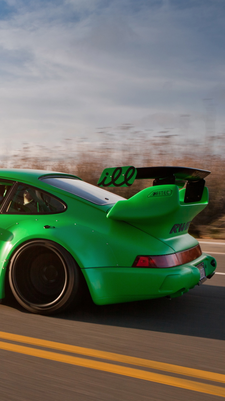 Green Volkswagen Beetle on Road During Daytime. Wallpaper in 750x1334 Resolution